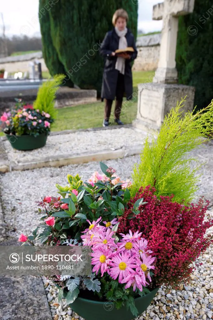 Woman in cemetery, Saint_Antonin_de_Sommaire, Eure, France, Europe