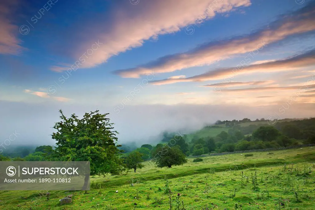 Mist approaches the sloped fields and woodland above the Usk Valley near Llangynidr, Brecon Beacons, Powys, Wales, United Kingdom, Europe