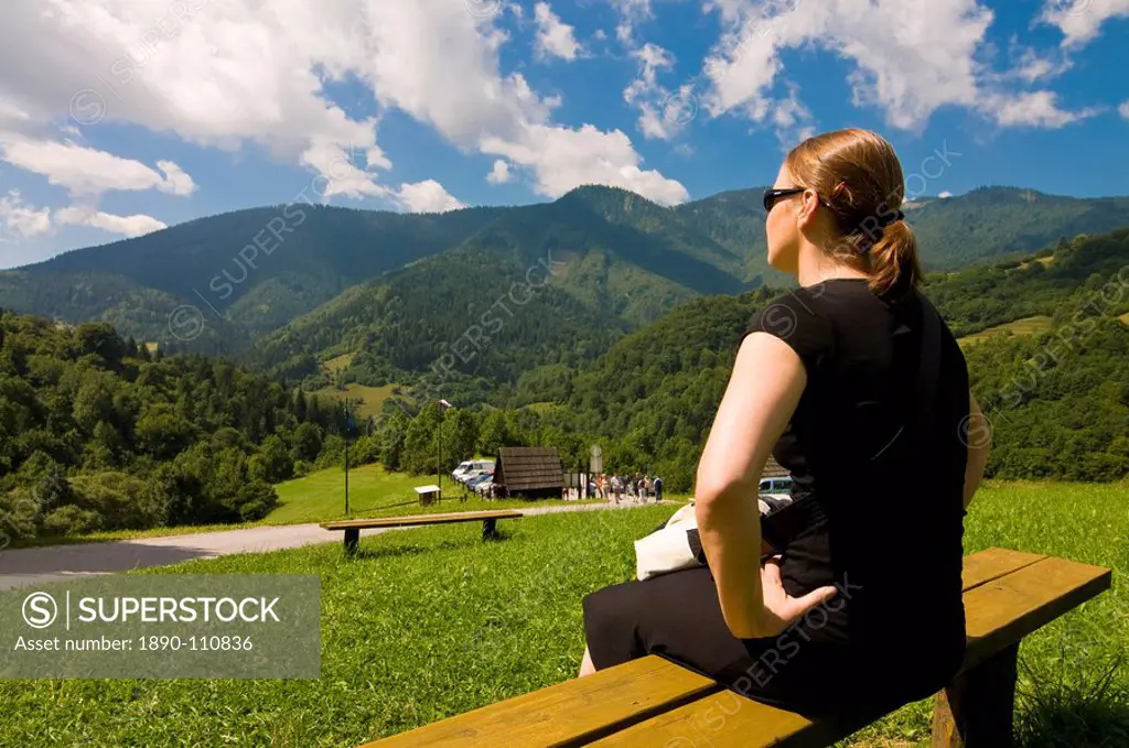 Tourist looking at the scenery around the the mountain village of Vlkolinec, High Tatra, Slovakia, Europe