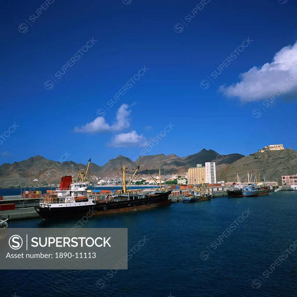 Cargo ships in port, with the town and mountains in the background, Mindelo, Sao Vicente Island, in the Republic of the Cape Verde Islands, Atlantic, ...