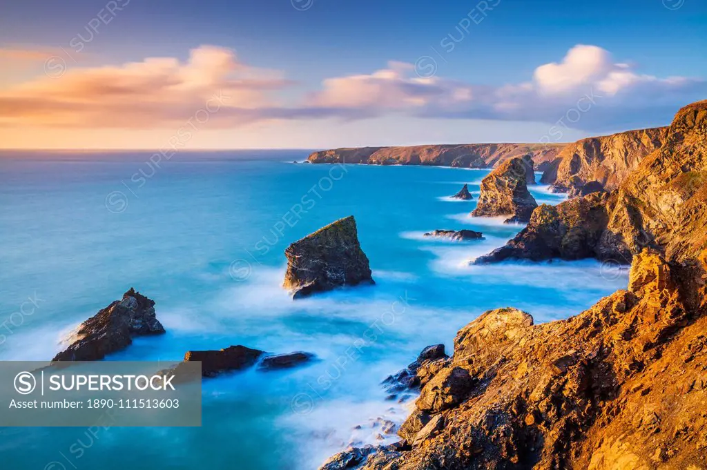 Sunset, Bedruthan steps sea stacks at high tide, Carnewas, Bedruthan, North Cornwall coast, Cornwall, England, United Kingdom, Europe