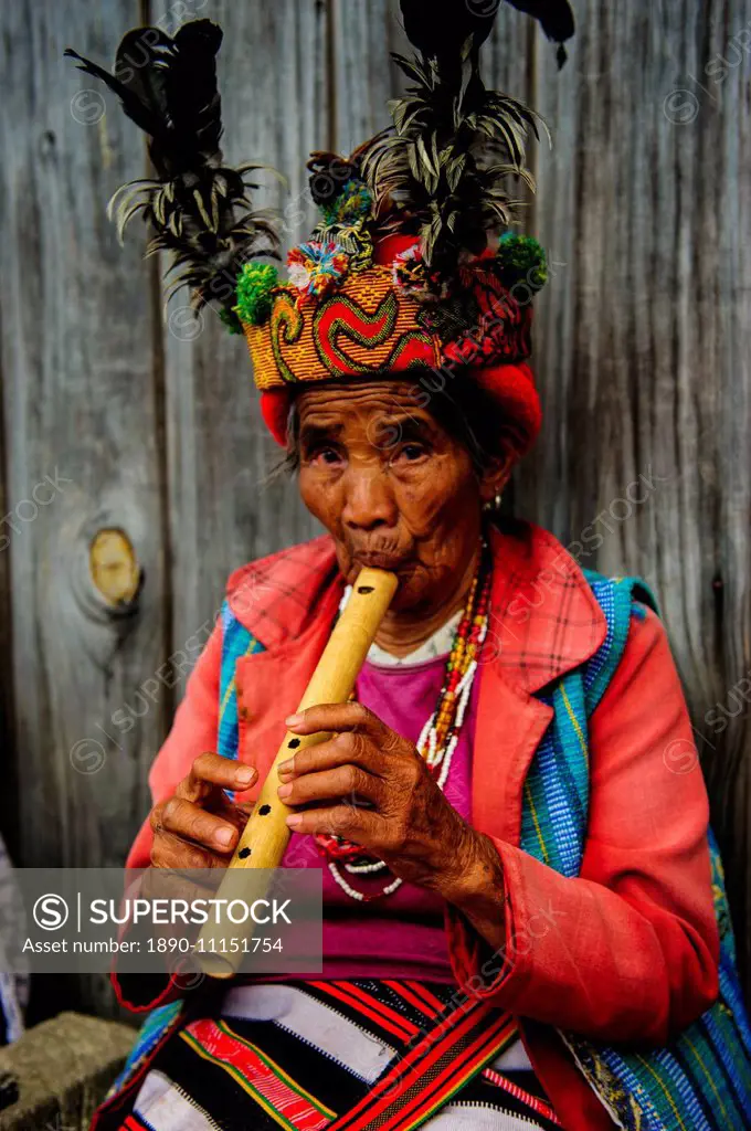 Traditional dressed Ifugao women playing the flute in Banaue, UNESCO World Heritage Site, Northern Luzon, Philippines, Southeast Asia, Asia