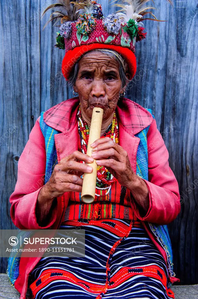 Traditional dressed Ifugao women playing the flute in Banaue, UNESCO World Heritage Site, Northern Luzon, Philippines, Southeast Asia, Asia