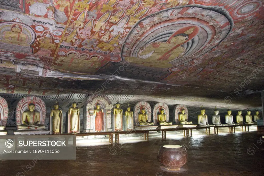 Statues and painted roof in natural cave in granite, Cave No 2, Maharaja Viharaya Temple of the Great King, Royal Rock Cave Temples, Dambulla, Sri Lan...