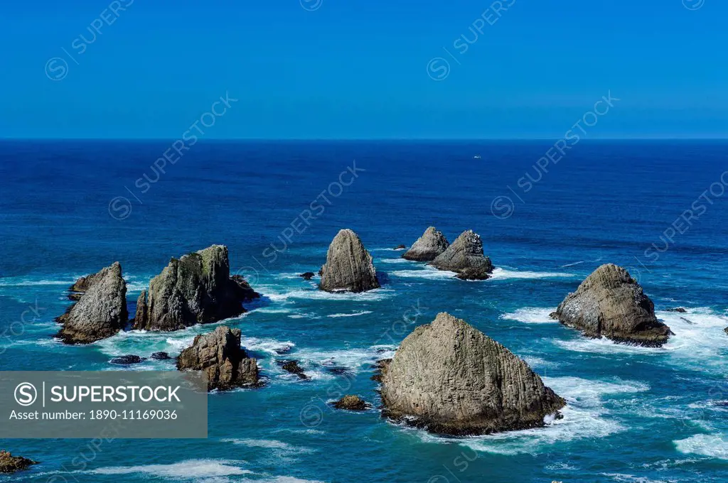 View from the Nugget Point Lighthouse in the turquoise waters with huge rocks, the Catlins, South Island, New Zealand, Pacific