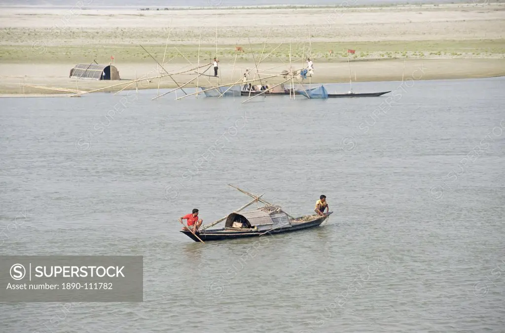 Fishermen, nets and boats on the Brahmaputra River, near Guwahati, Assam, India, Asia