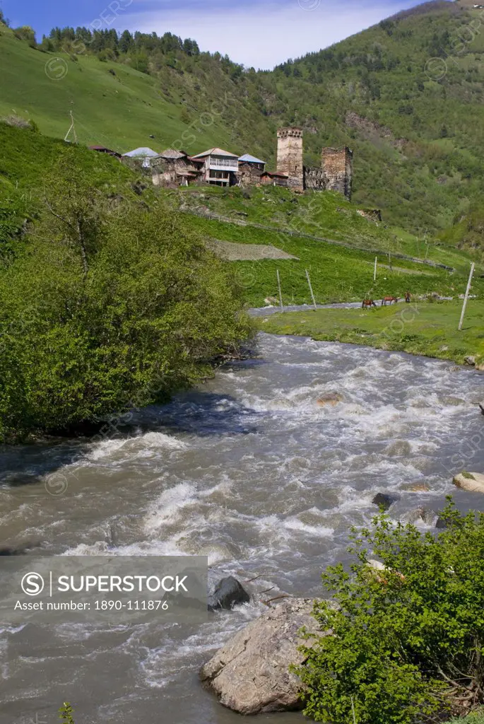 Little river running below a fortified mountain village, Svanetia, Georgia, Caucasus, Central Asia, Asia