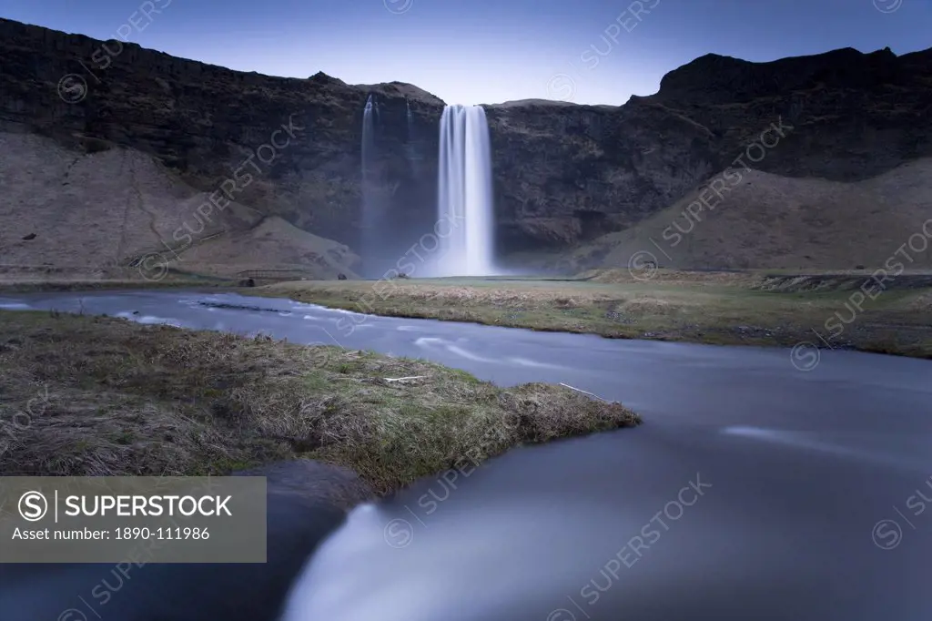 Seljalandsfoss Waterfall captured at dusk using long exposure to record movement in the water, near Hella, southern area, Iceland, Polar Regions