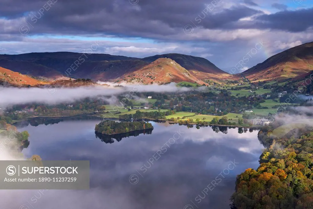 Mist burns off Lake Grasmere in the early morning, Lake District National Park, Cumbria, England, United Kingdom, Europe