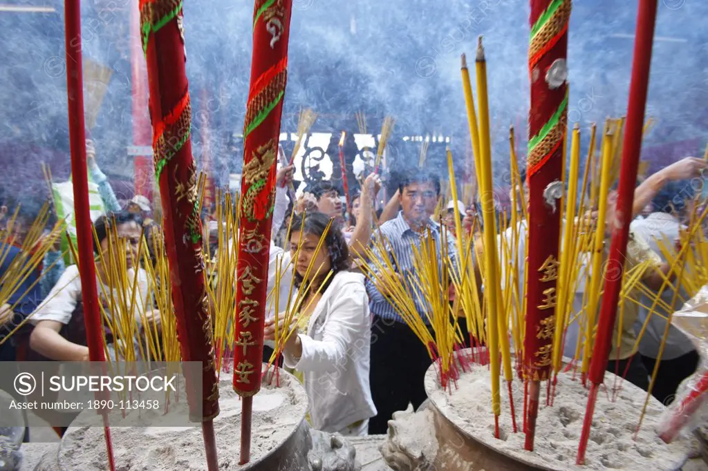 Burning incense during Tet, the Vietnamese lunar New Year celebration, Thien Hau Temple, Ho Chi Minh City, Vietnam, Indochina, Southeast Asia, Asia
