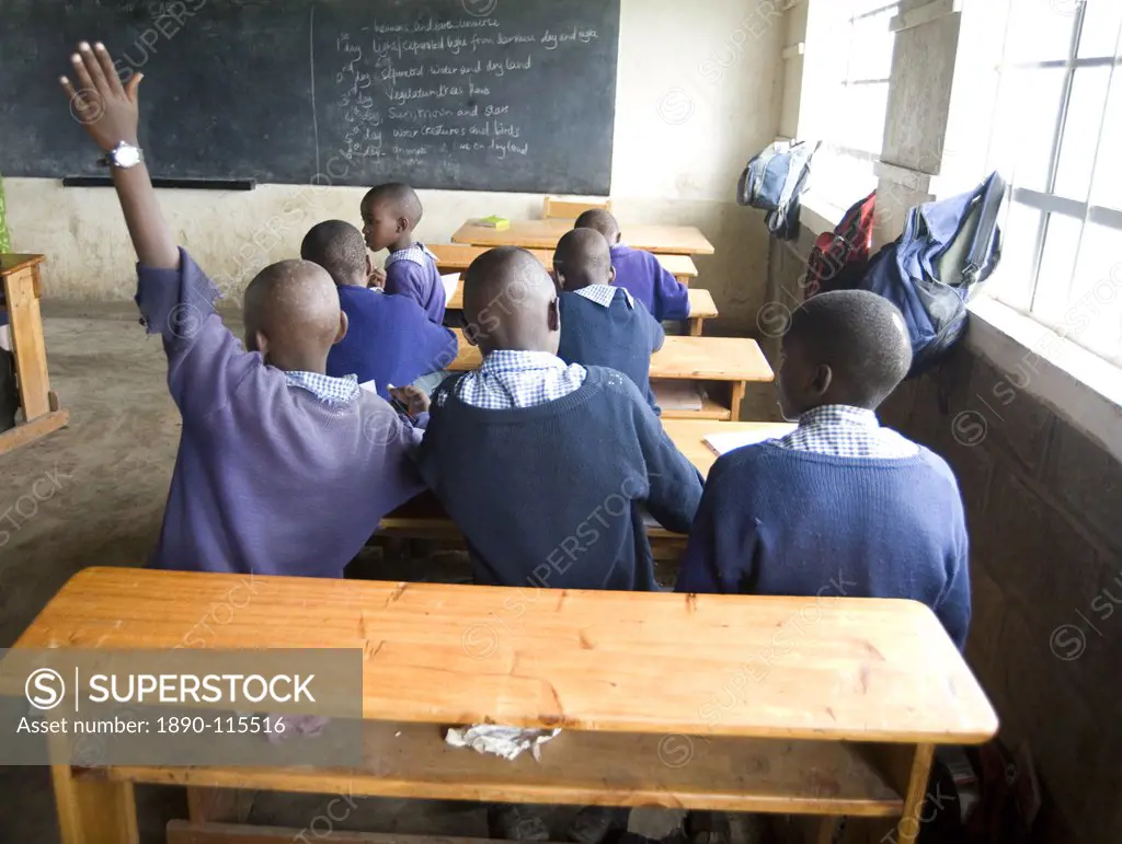 Eager schoolboys working in new school classroom, Langalanga Primary School, Gilgil district, Rift Valley, Kenya, East Africa, Africa