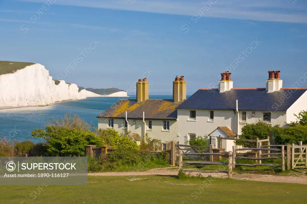 View of The Seven Sisters cliffs, the coastguard cottages on Seaford Head, South Downs Way, South Downs National Park, East Sussex, England, United Ki...