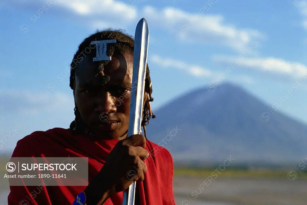 Masai Moran with Lengai, the Masai Mountain of God in background, Tanzania, East Africa, Africa