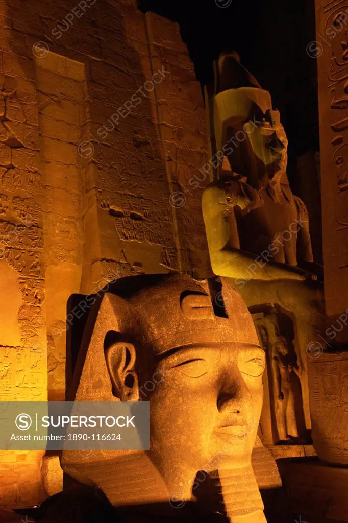 Floodlit statues of Ramses II, Temple of Luxor, UNESCO World Heritage Site, Luxor, Thebes, Egypt, North Africa, Africa