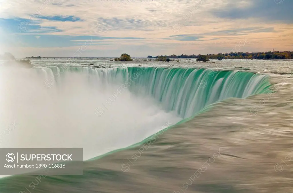 Blurry slow motion water at the top of the Horseshoe Falls waterfall on the Niagara River, Niagara Falls, Ontario, Canada, North America