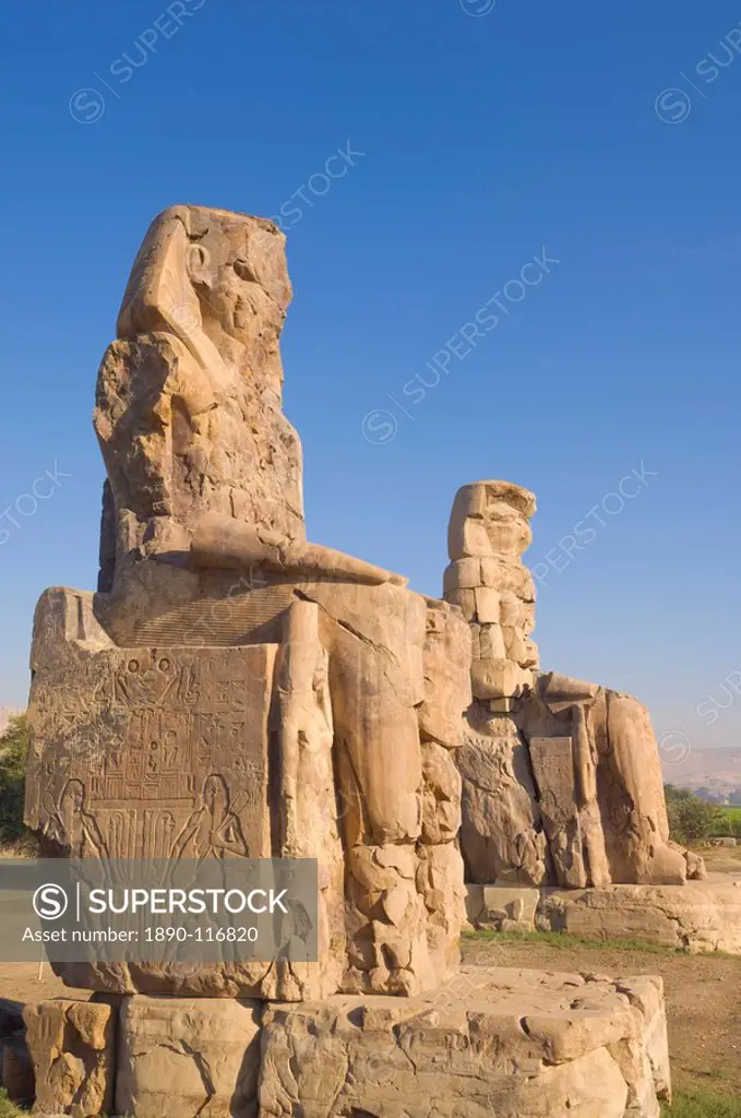 Two giant statues known as the Colossi of Memnon carved to represent the pharaoh Amenhotep III of the dynasty XVIII, West bank of the River Nile,Thebe...