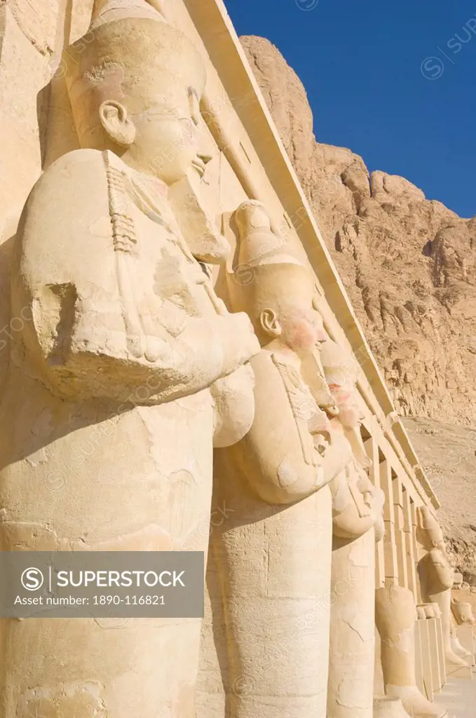 Restored Osirid statues of the female pharaoh Hatshepsut on the pillars of the portico entrance to the third terrace of theTemple of Hatshepsut, Deir ...