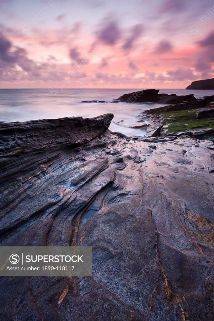 Twilight beside the rocky shore of Trebarwith Strand, Cornwall, England, United Kingdom, Europe