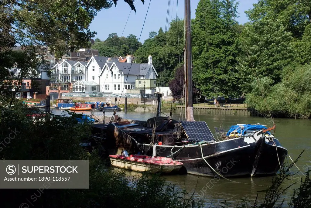 Boats, one with a solar panel, moored on the Thames at Richmond, Surrey, England, United Kingdom, Europe