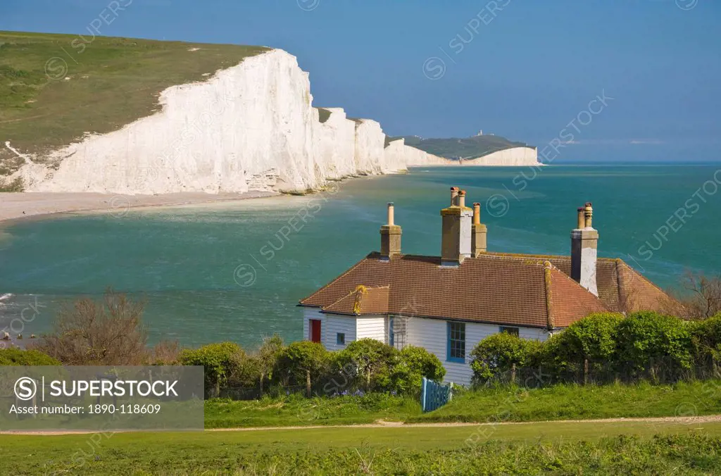 The Seven Sisters chalk cliffs, the coastguard cottages on Seaford Head, South Downs Way, South Downs National Park, East Sussex, England, United King...