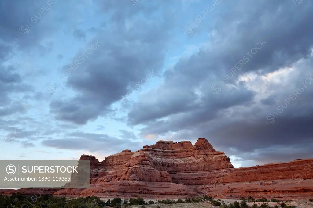 Red rock formation at sunset with clouds, The Needles District, Canyonlands National Park, Utah, United States of America, North America