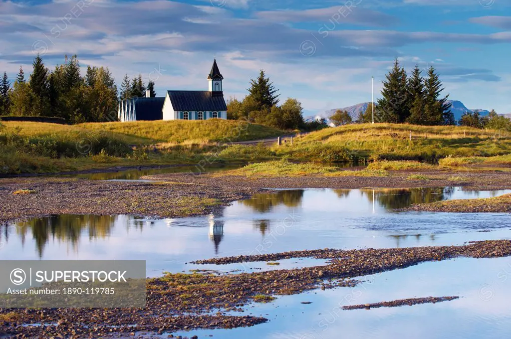 Thingvellir national church, built in 1859 on the site of Iceland´s first church constructed in 1000 AD, seen from Oxaraholmi, an island in the River ...