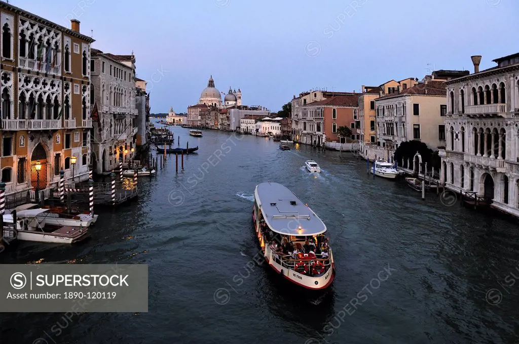 Evening view of a vaporetto water bus on the Grand Canal, Venice, UNESCO World Heritage Site, Veneto, Italy, Europe