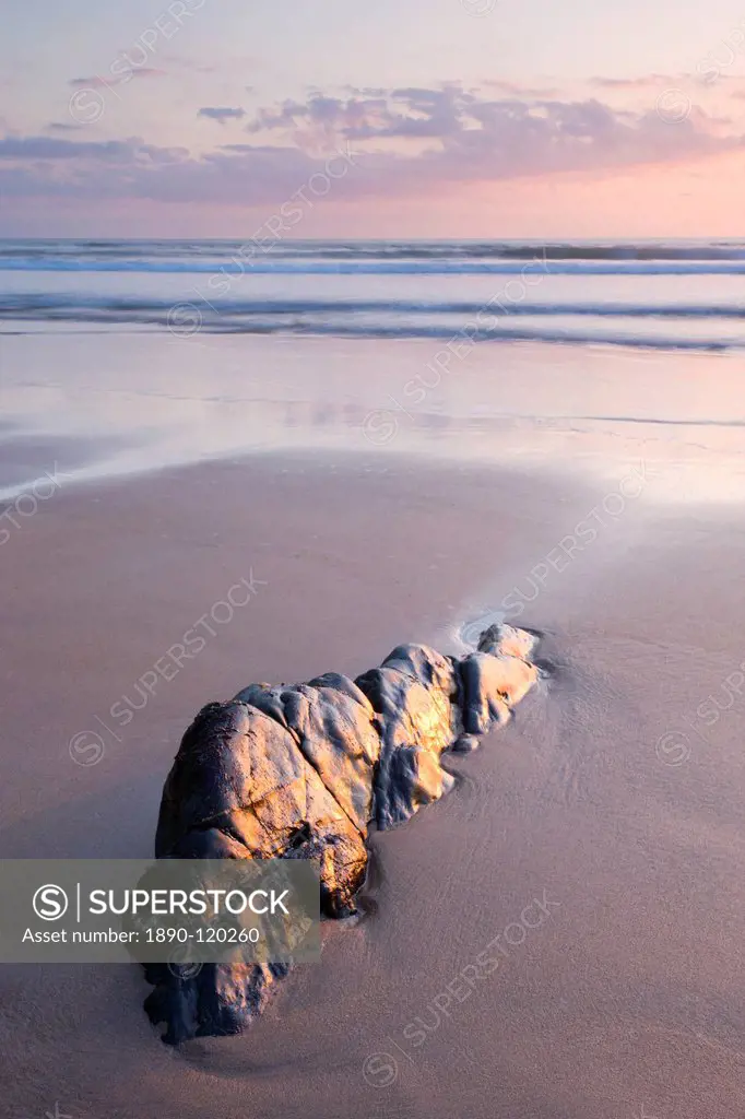 Rock and sand at sunset, Sandymouth Bay, Cornwall, England, United Kingdom, Europe