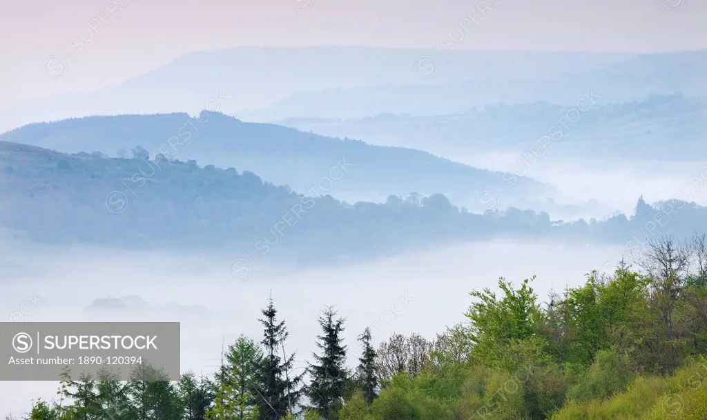 Misty mountains of the Brecon Beacons at dawn, from Allt yr Esgair, Brecon Beacons National Park, Powys, Wales, United Kingdom, Europe
