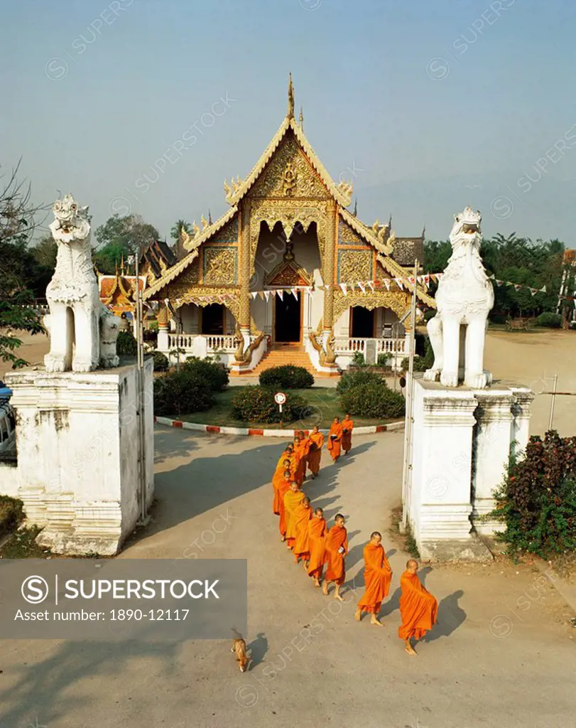 Monks leaving Wat Phra Singh to collect alms, Chiang Mai, Thailand, Southeast Asia