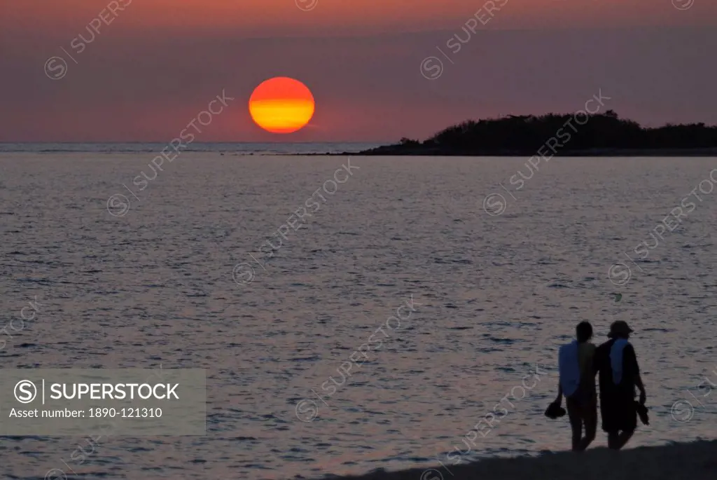 Walking couple at sunset, Playa Ancon, Trinidad, Cuba, West Indies, Caribbean, Central America