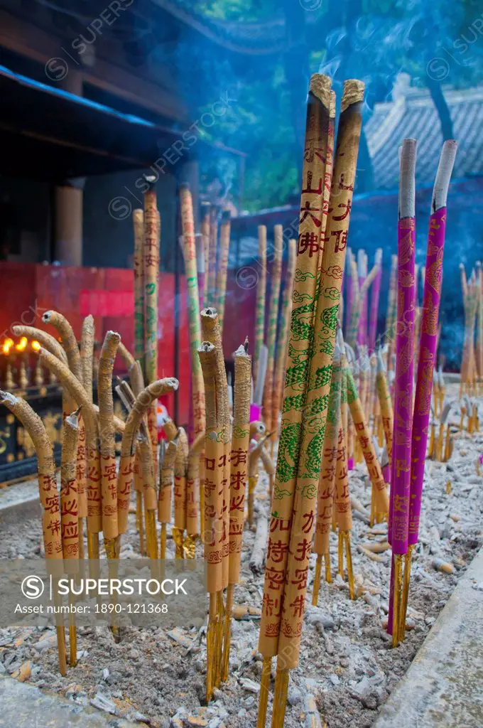 Burning sticks of Tibetan incense in a monastery above the giant Buddha of Leshan, Sichuan, China, Asia