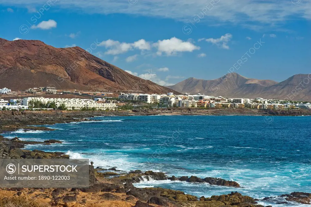 The rocky west extremity of the sea front at the popular resort of Playa Blanca on the far south coast, Playa Blanca, Lanzarote, Canary Islands, Spain...