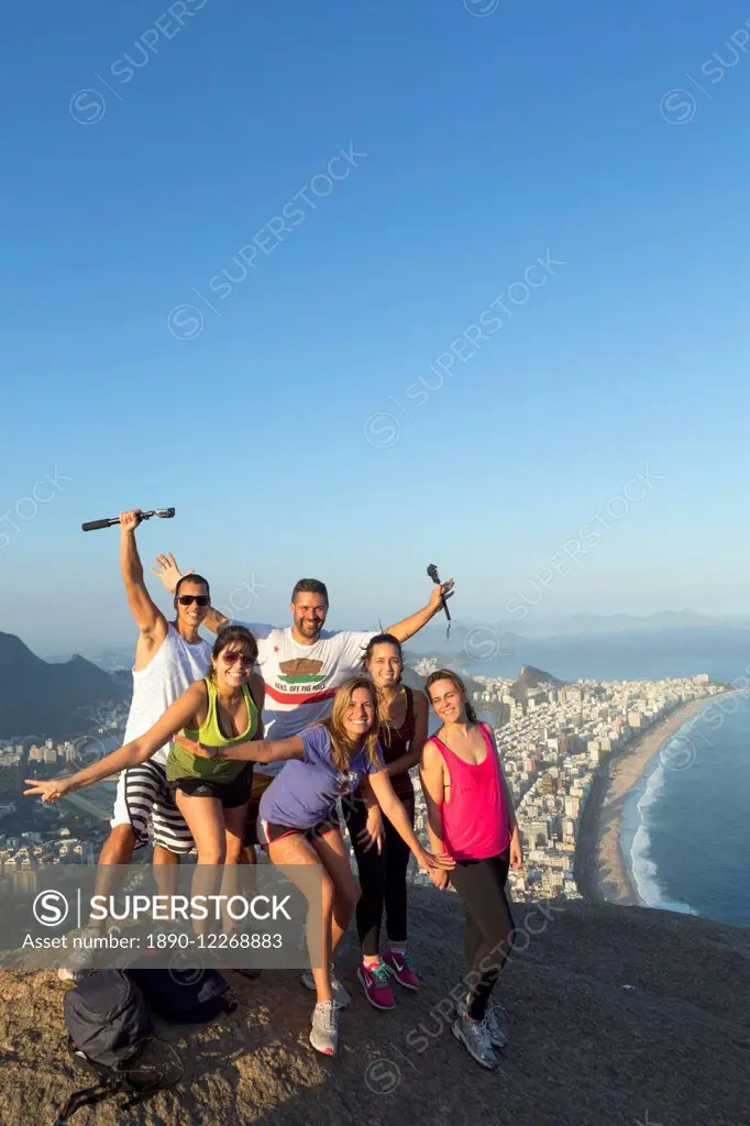 Local tourists on the summit of Dois Irmaos peak (Two Brothers Peak) with Ipanema, Corcovado and Rio city below, Rio de Janeiro, Brazil, South America