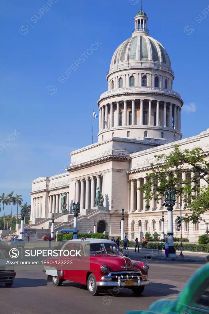 Traditonal old American cars passing the Capitolio building, Havana, Cuba, West Indies, Caribbean, Central America