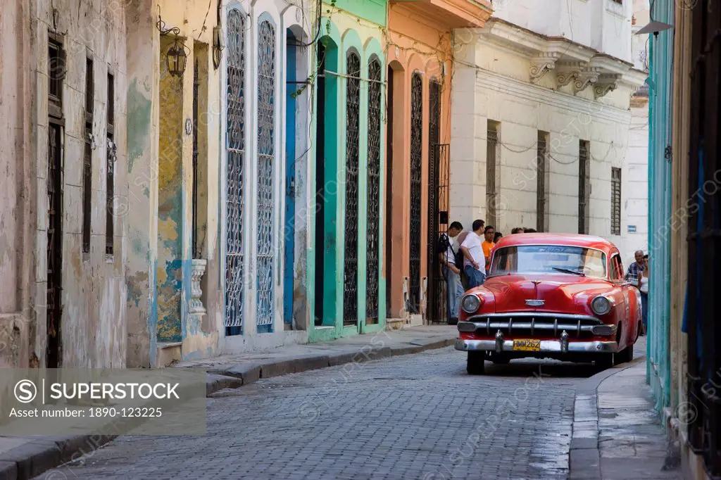 Colourful street with traditional old American car parked, Old Havana, Cuba, West Indies, Caribbean, Central America