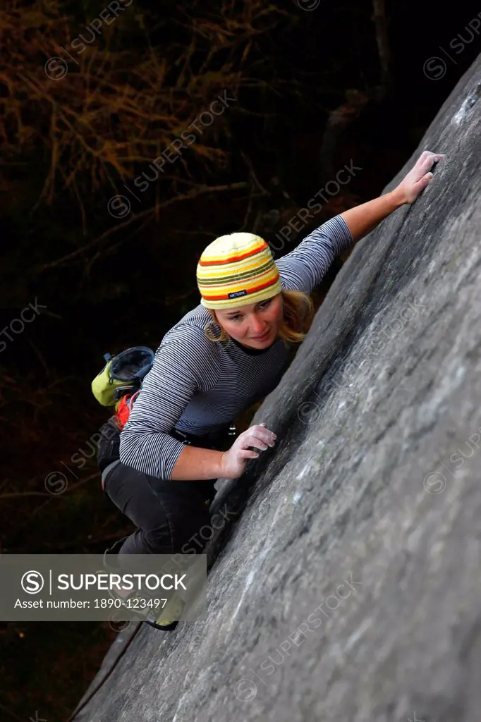 A climber on a difficult route on the cliffs known as The Roaches, Staffordshire, Peak District, England, United Kingdom, Europe