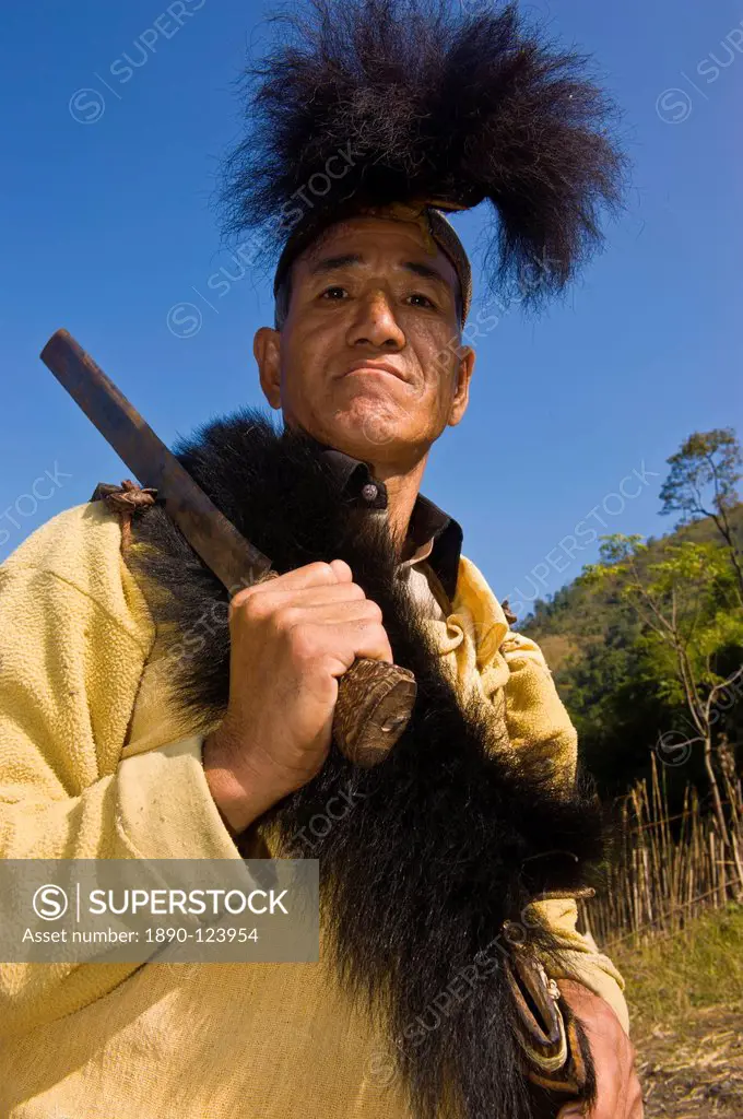 Traditionally dressed man with machete from the Hillmiri tribe, Arunachal Pradesh, Northeast India, India, Asia