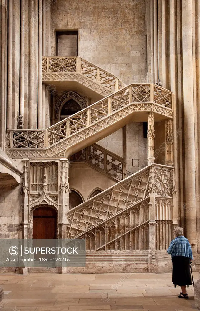 Lady with walking stick looking at Booksellers´ Staircase, Rouen Cathedral, Rouen, Upper Normandy, France, Europe