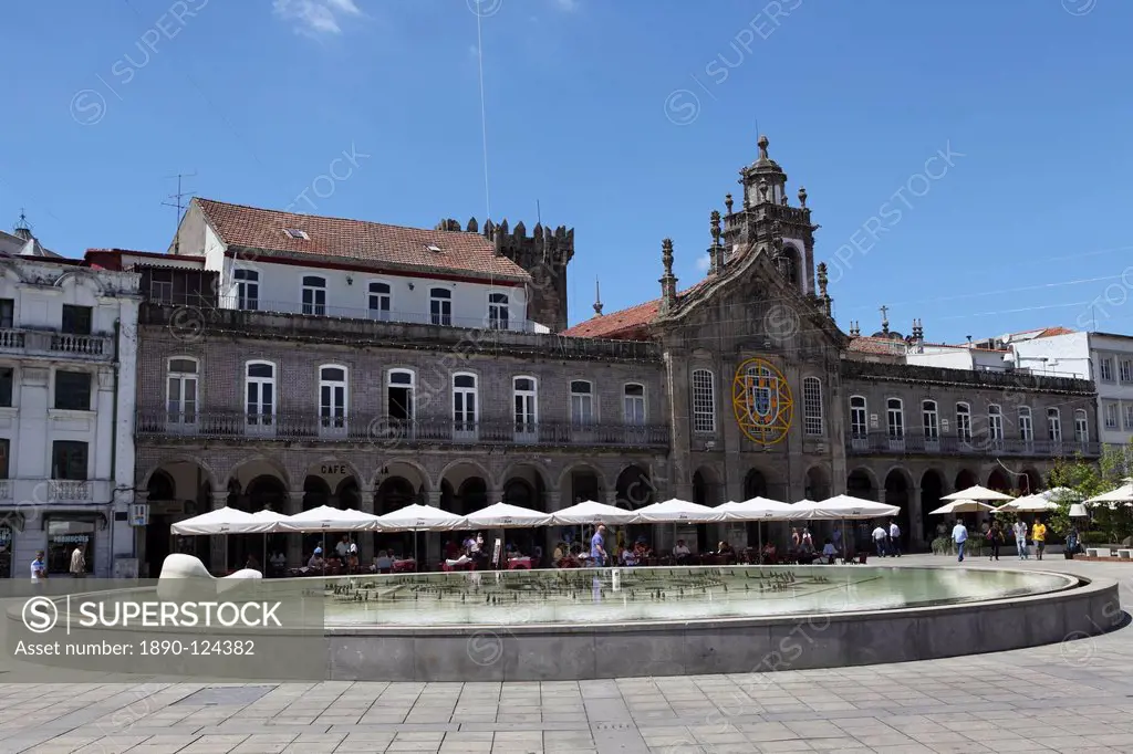Cafes stand in front of La Arcade and Igreja da Lapa church on the Praca da Republica, Braga, Minho, Portugal, Europe