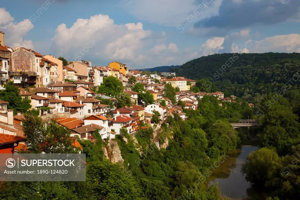 Stormy weather at dusk over hillside houses above the Yantra River, Veliko Tarnovo, Bulgaria, Europe