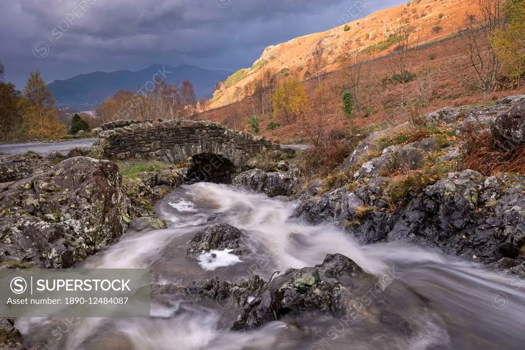 Rocky stream tumbling under Ashness Bridge in autumn, Lake District National Park, Cumbria, England, United Kingdom, Europe