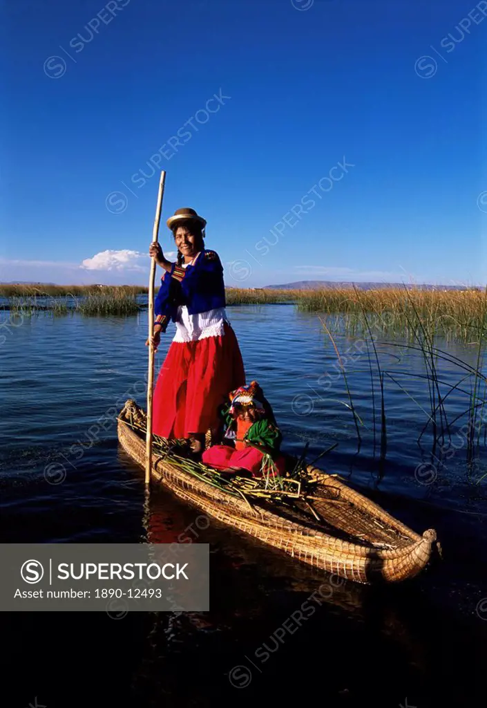 Uros Indian woman and traditional reed boat, Islas Flotantes, Lake Titicaca, Peru, South America