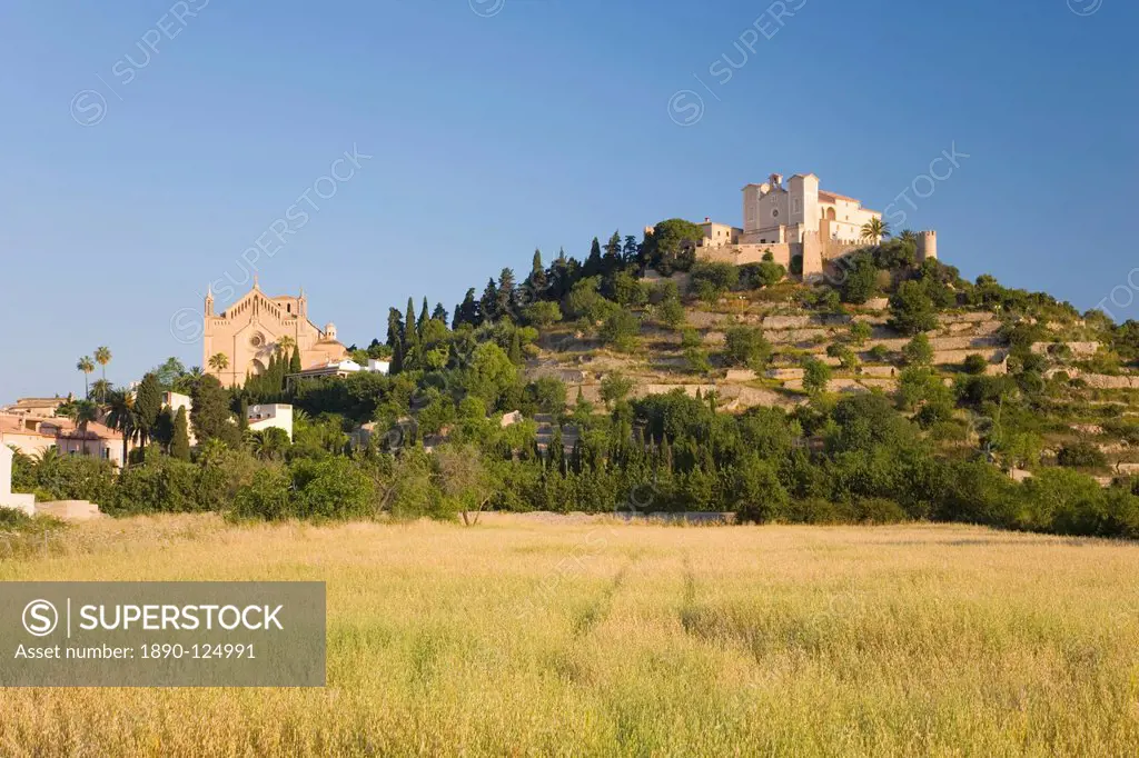 View across fields to the parish church and hilltop Sanctuary of Sant Salvador, Arta, Mallorca, Balearic Islands, Spain, Europe
