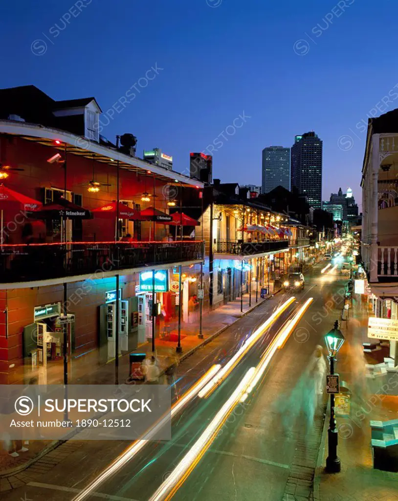 Bourbon Street and city skyline at night, New Orleans, Louisiana, United States of America, North America