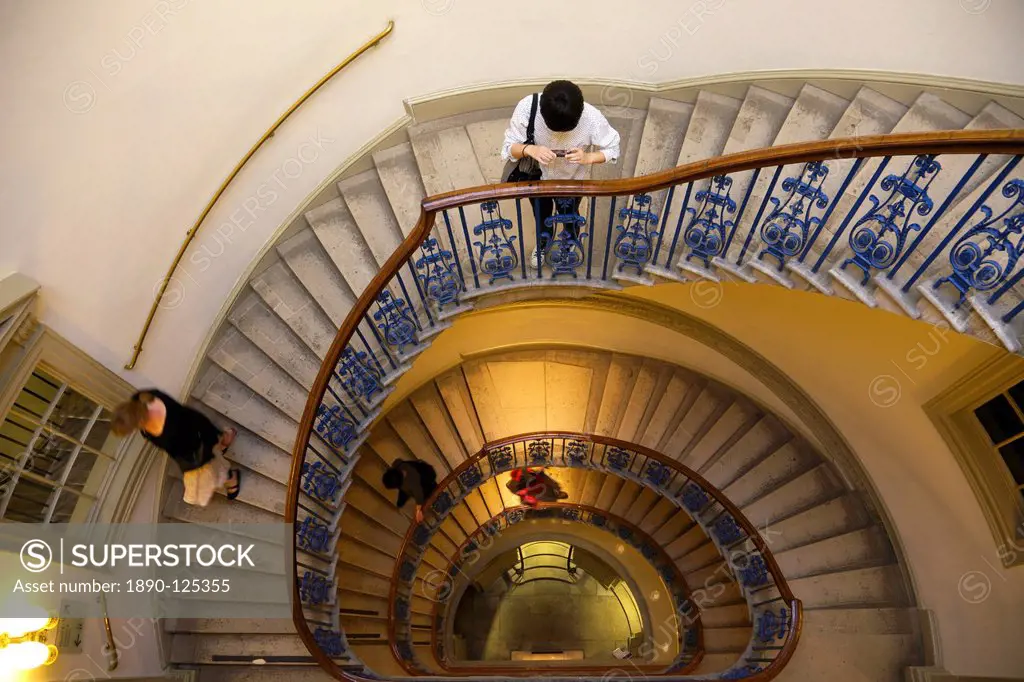 Visitors on circular stairway, Courtauld Galleries, Somerset House, London, England, United Kingdom, Europe