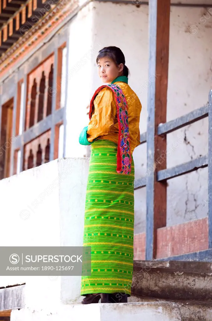 Young woman in colourful National Dress at the Wangdue Phodrang Tsechu, Wangdue Phodrang Dzong, Wangdue Phodrang Wangdi, Bhutan, Asia