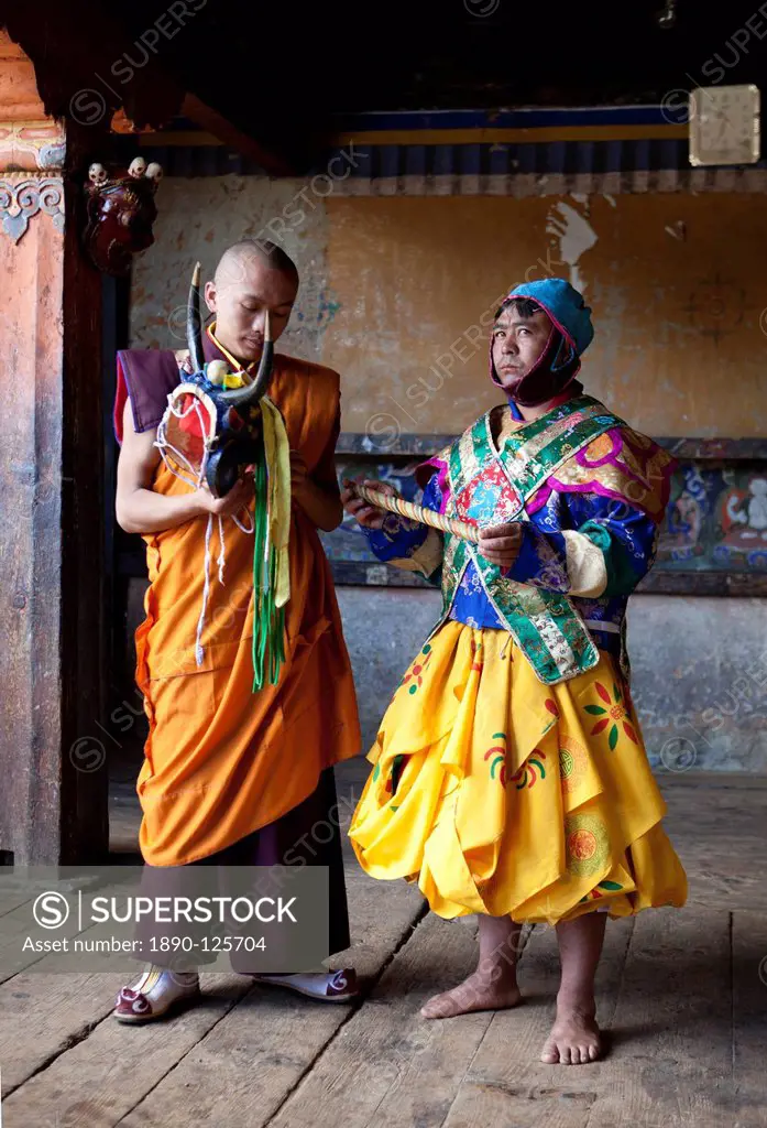 Buddhist monk in colourful costume waiting to take part in traditional dance at the Tamshing Phala Choepa Tsechu, near Jakar, Bumthang, Bhutan, Asia