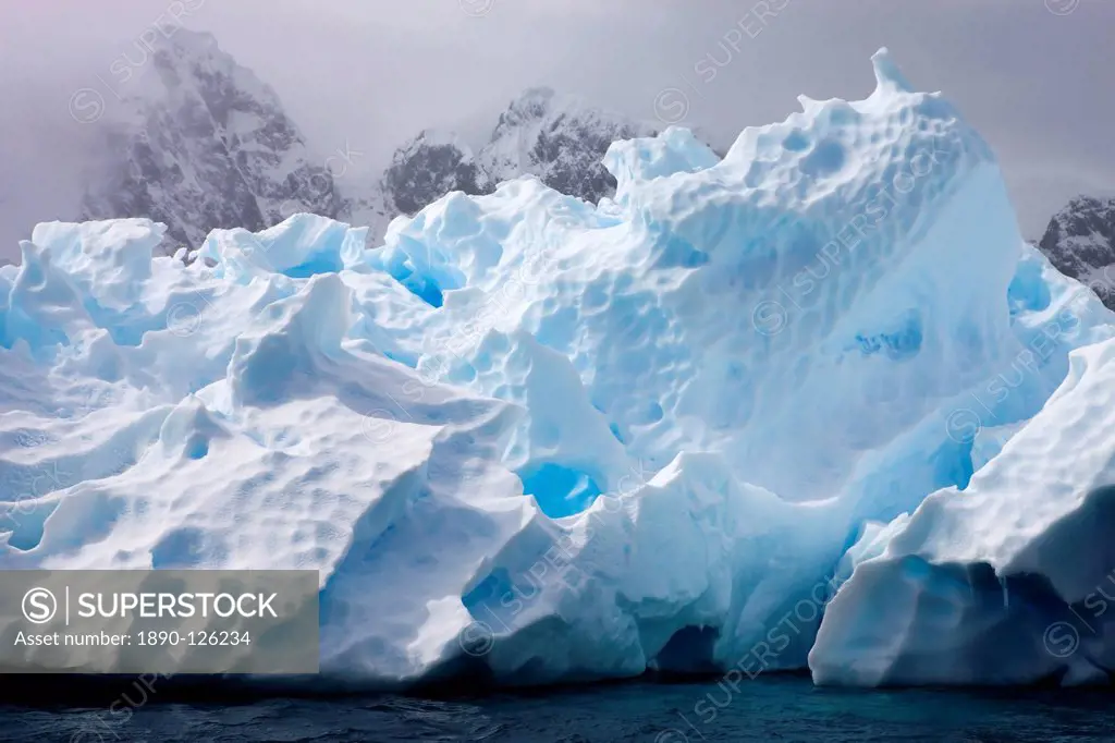 Intricate ice patterns on a weathered iceberg, Pleneau Island, Antarctic Peninsula, Antarctica, Polar Regions
