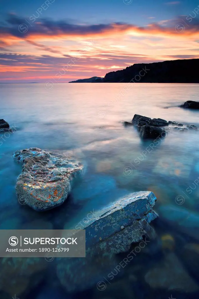 Sunset over Gad Cliff which towers over Hobarrow and Brandy Bays, Jurassic Coast, UNESCO World Heritage Site, Dorset, England, United Kingdom, Europe